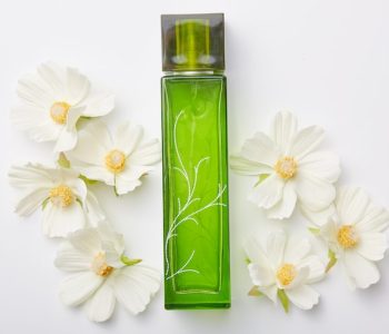 perfume-women-green-bottle-flowers-around-isolated-white-pleasant-aromat-odor-floral-fragrance_176532-8988